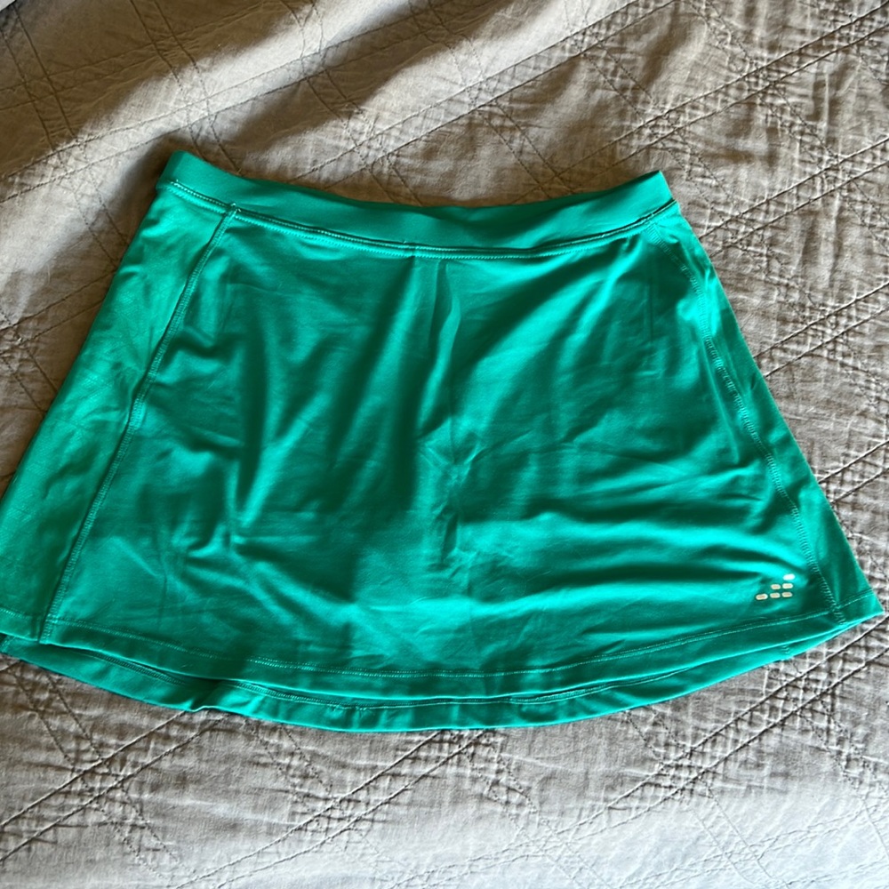 Teal tennis skort. Never worn and to big now.